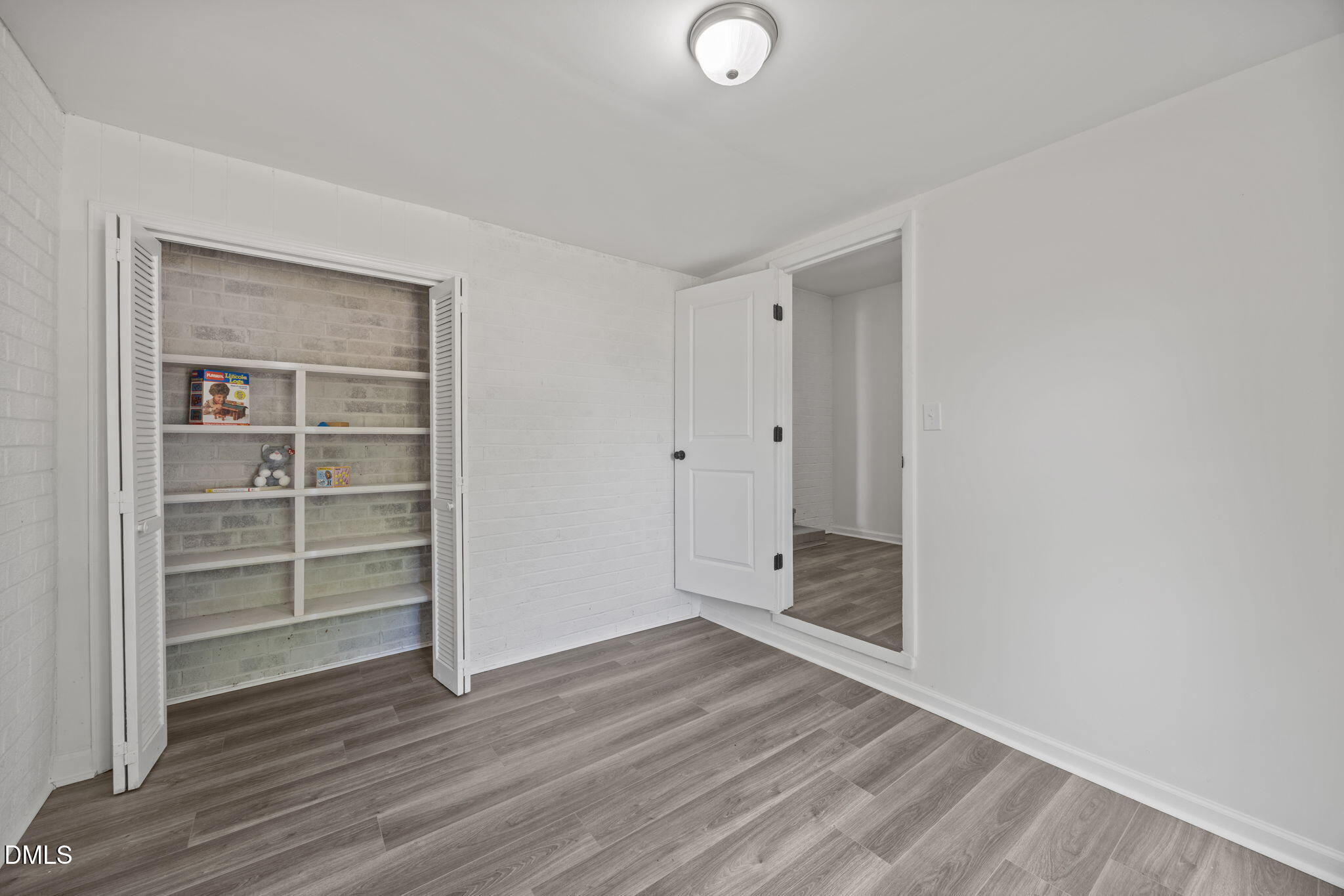 6561 Huntsboro Road Oxford, NC 27565 - Photo 11 of 41 a view of a room with wooden floor & closet area
