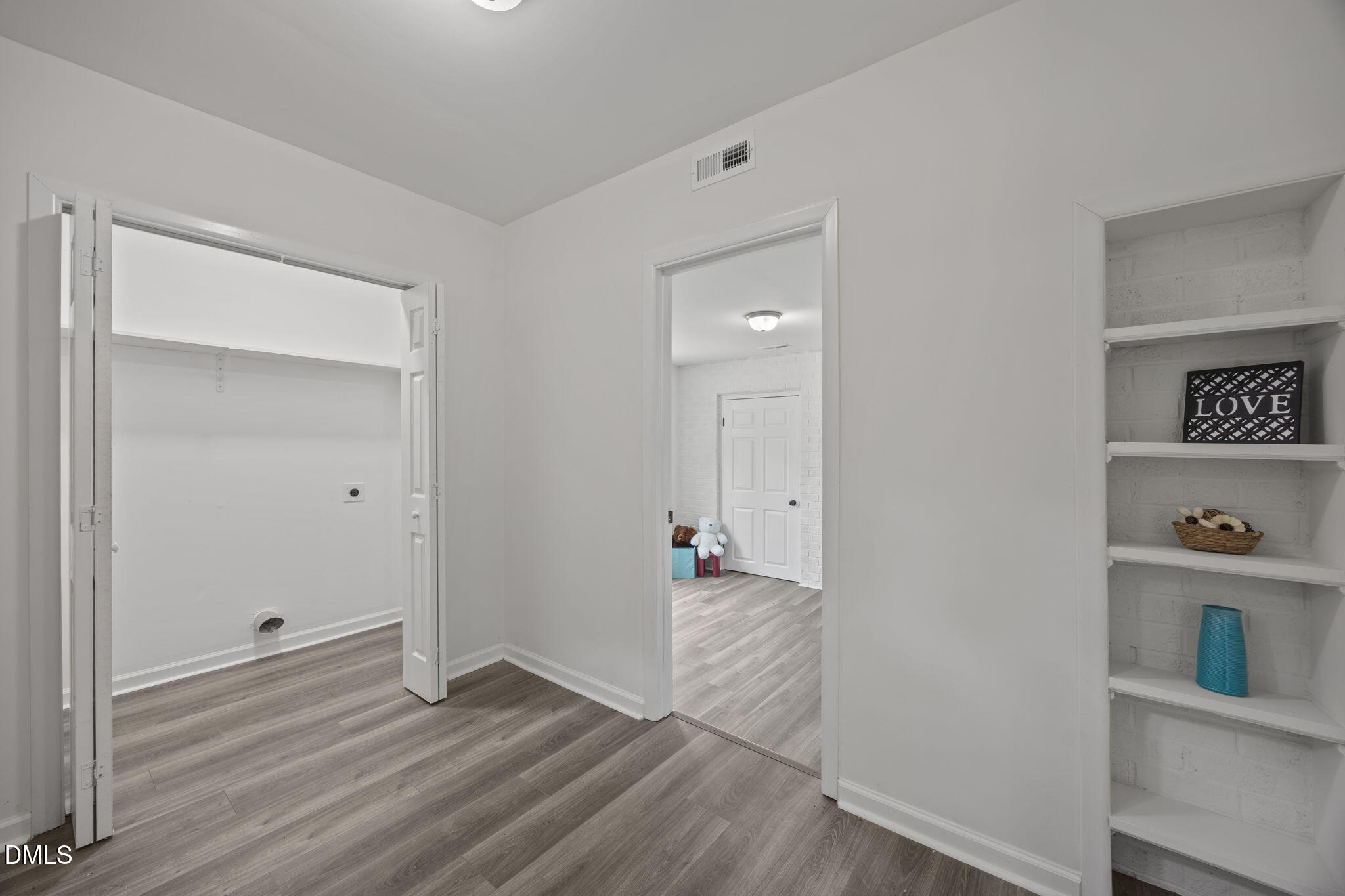 6561 Huntsboro Road Oxford, NC 27565 - Photo 12 of 41 an empty room with wooden floor and closet