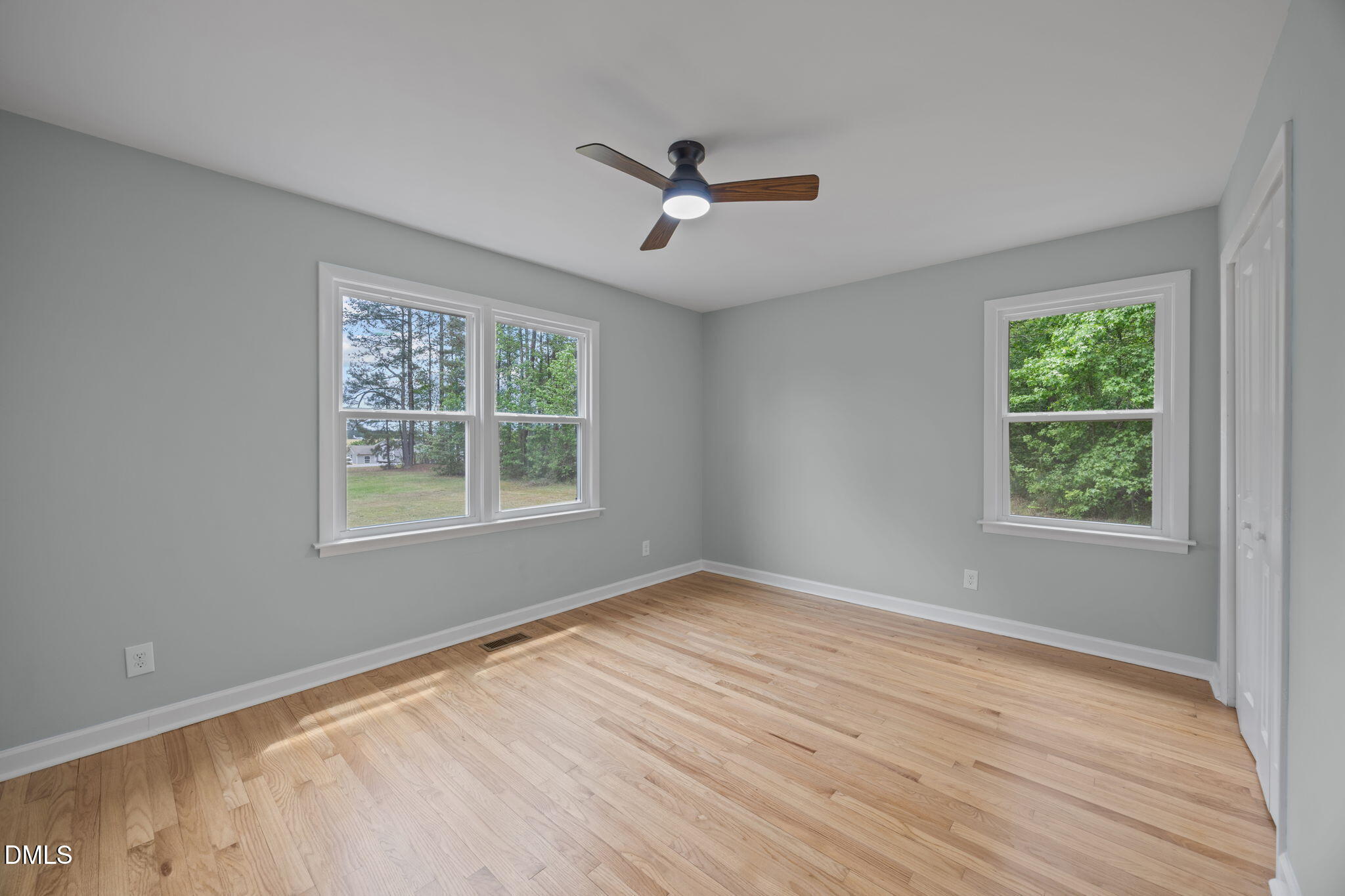 6561 Huntsboro Road Oxford, NC 27565 - Photo 13 of 41 a view of an empty room with wooden floor and a window