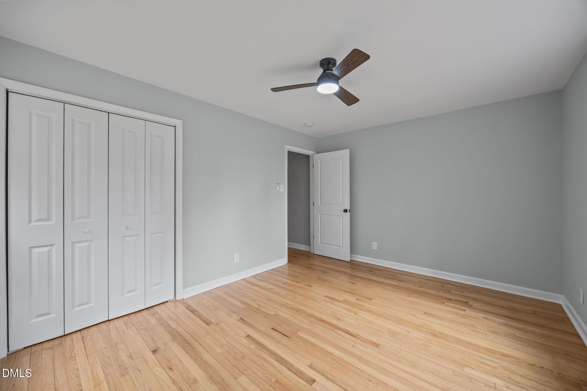 6561 Huntsboro Road Oxford, NC 27565 - Photo 14 of 41 a view of empty room with wooden floor and fan