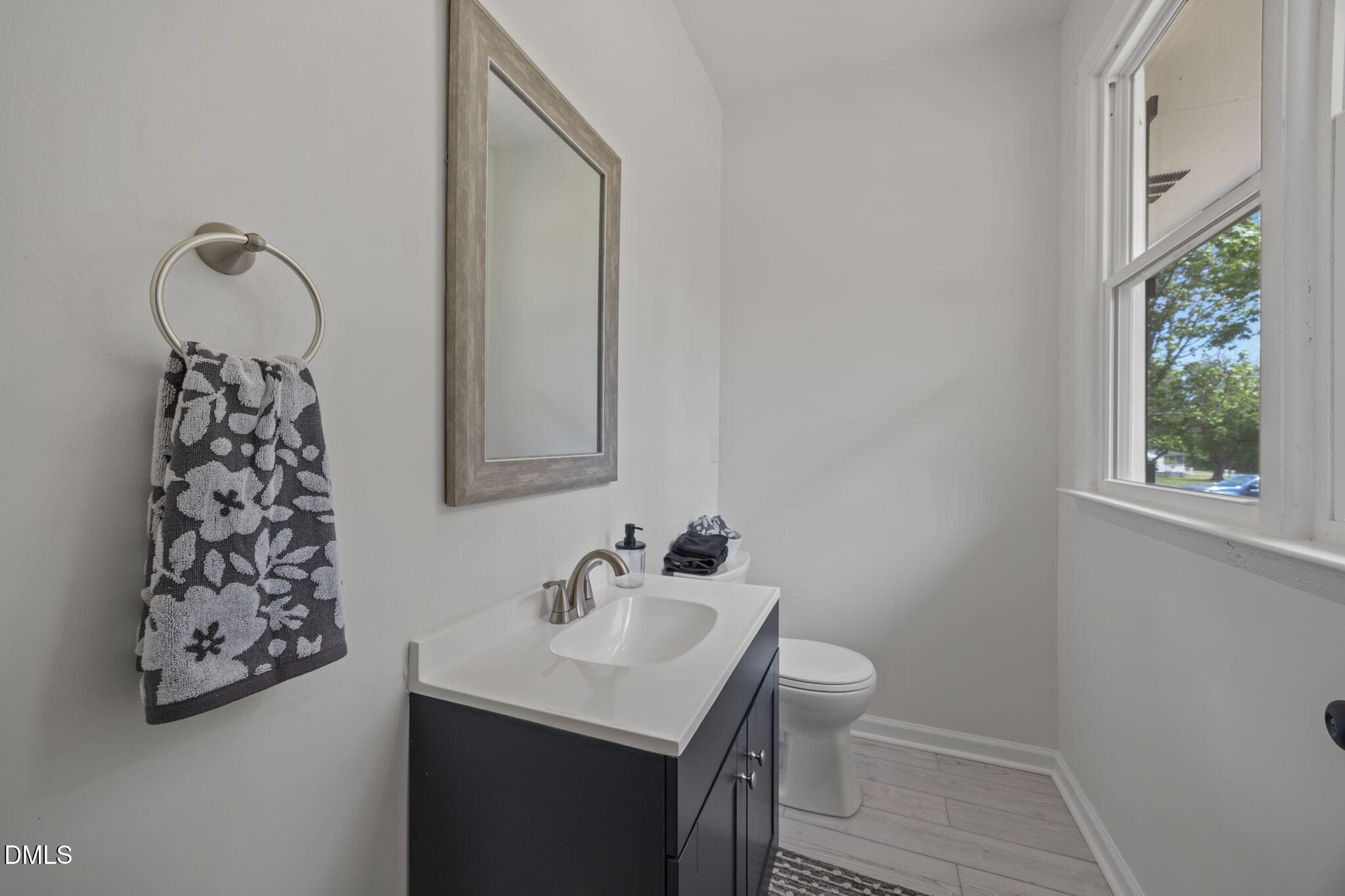 6561 Huntsboro Road Oxford, NC 27565 - Photo 16 of 41 a bathroom with a sink toilet and a mirror