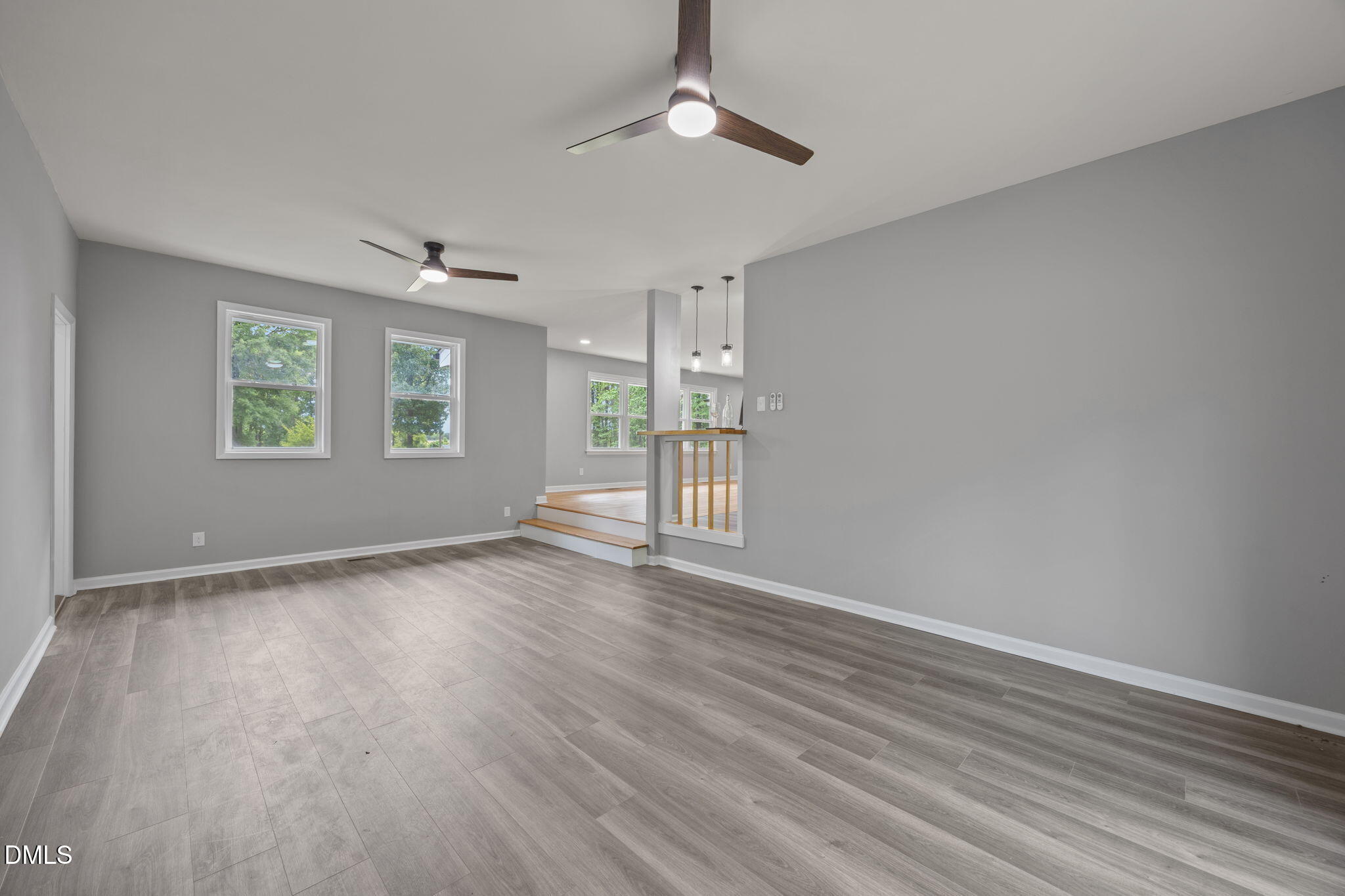 6561 Huntsboro Road Oxford, NC 27565 - Photo 19 of 41 wooden floor in an empty room with a window