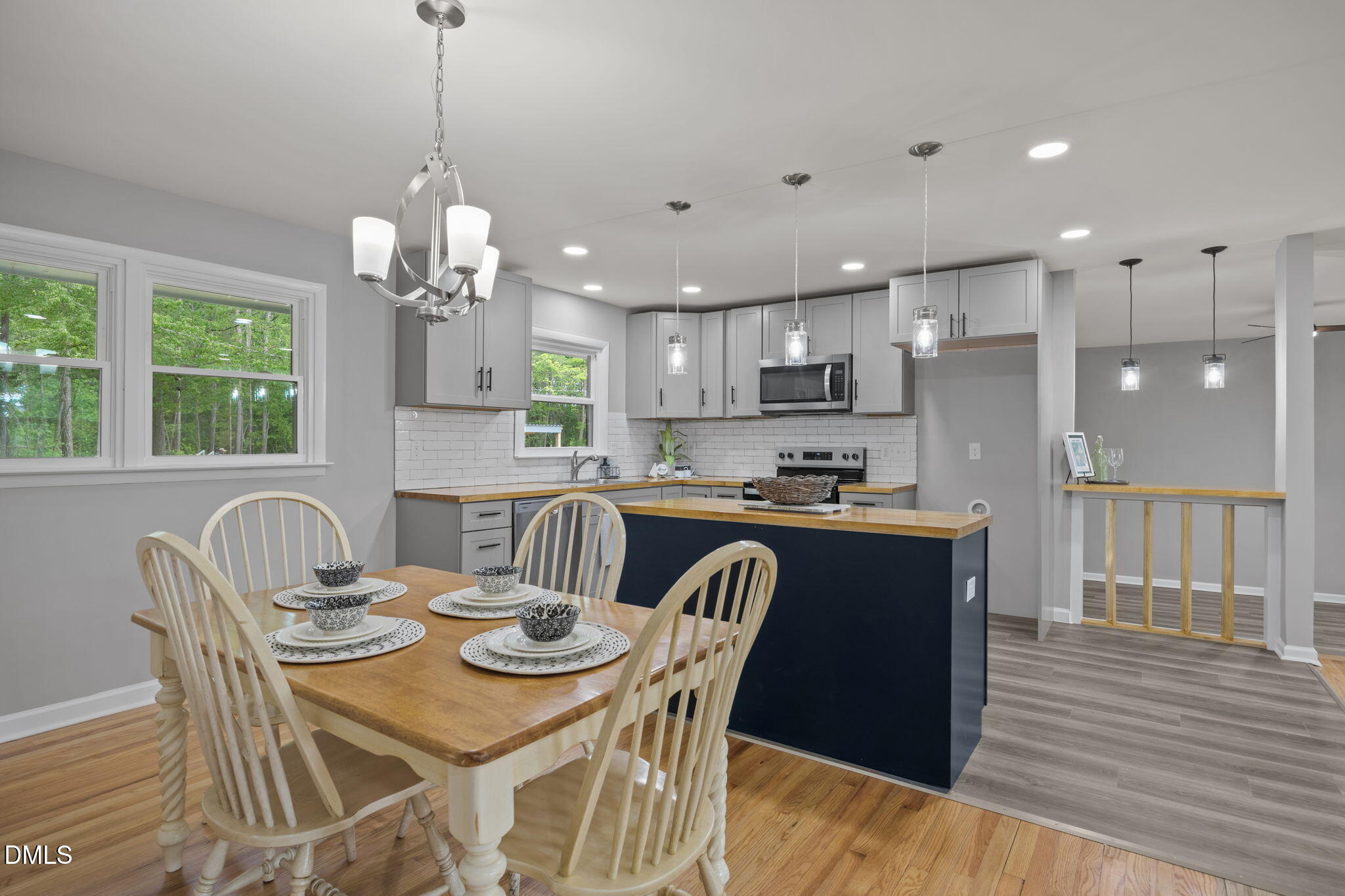 6561 Huntsboro Road Oxford, NC 27565 - Photo 20 of 41 a view of a dining room and a kitchen with a table chairs