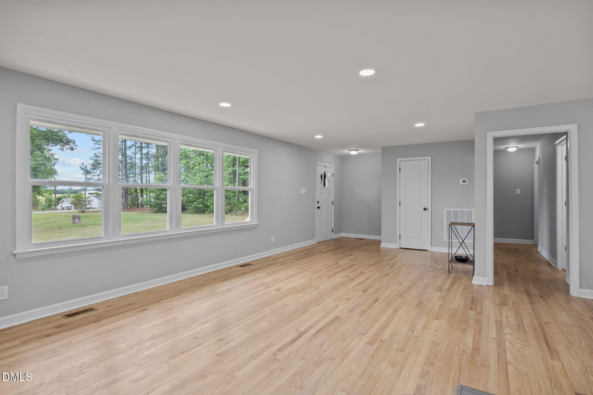 6561 Huntsboro Road Oxford, NC 27565 - Photo 26 of 41 a view of empty room with wooden floor and fan