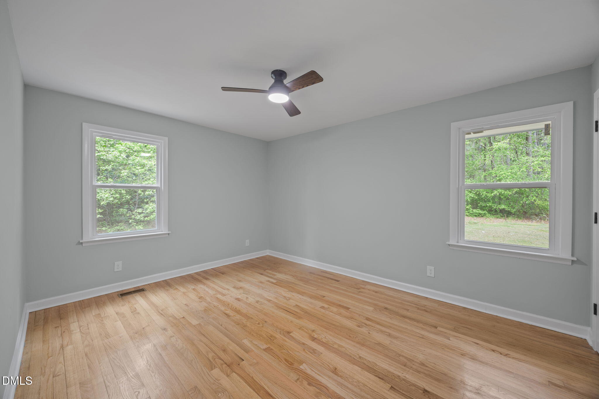 6561 Huntsboro Road Oxford, NC 27565 - Photo 33 of 41 a view of an empty room with wooden floor and a window