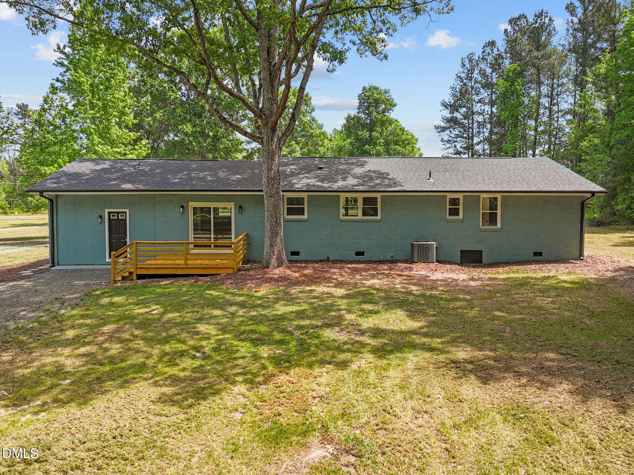 6561 Huntsboro Road Oxford, NC 27565 - Photo 6 of 41 a view of a house with a backyard and a tree
