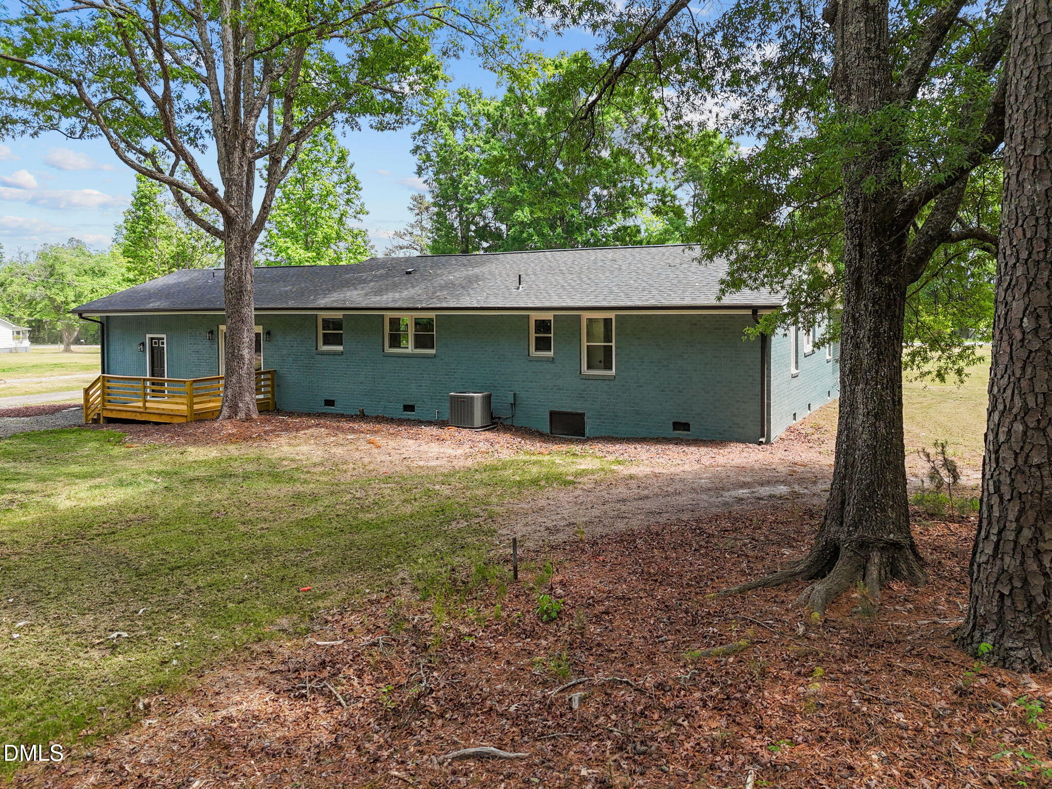 6561 Huntsboro Road Oxford, NC 27565 - Photo 7 of 41 a front view of a house with a garden and trees
