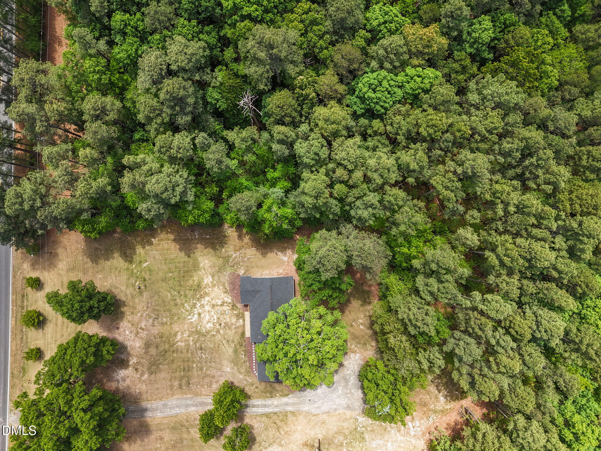 6561 Huntsboro Road Oxford, NC 27565 - Photo 8 of 41 a view of a lake with a house