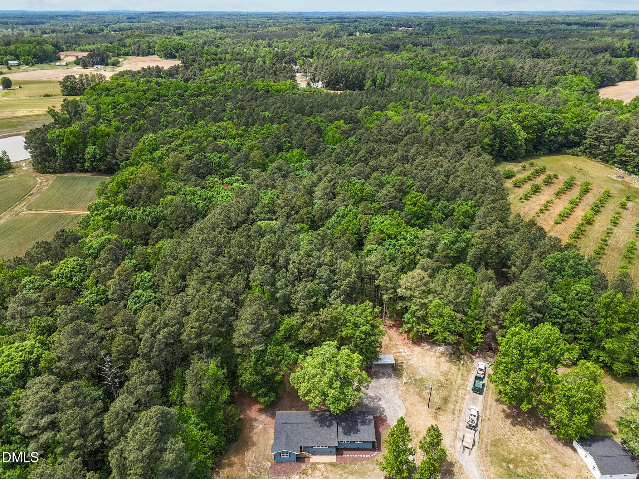 6561 Huntsboro Road Oxford, NC 27565 - Photo 9 of 41 an aerial view of residential houses with outdoor space and trees