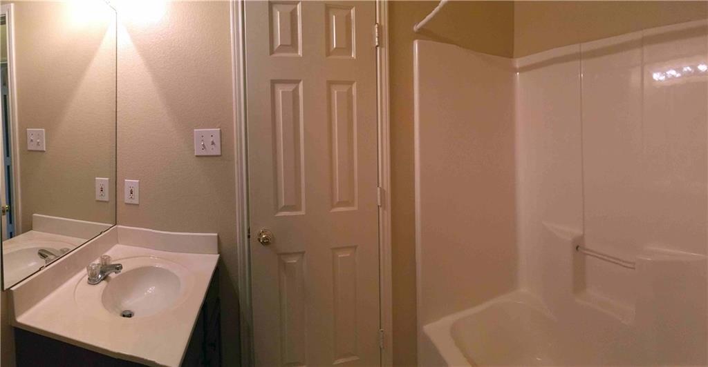 6740 Red Rock Trail Watauga, TX 76137 - Photo 14 of 16 a bathroom with a sink and shower