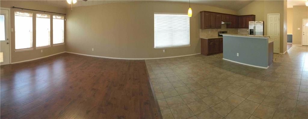 6740 Red Rock Trail Watauga, TX 76137 - Photo 10 of 16 a view of a kitchen with a sink dishwasher and a microwave oven