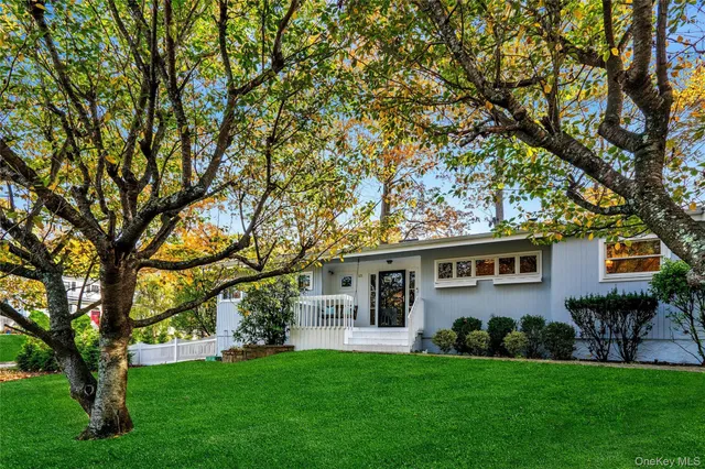 front view of a house with a yard