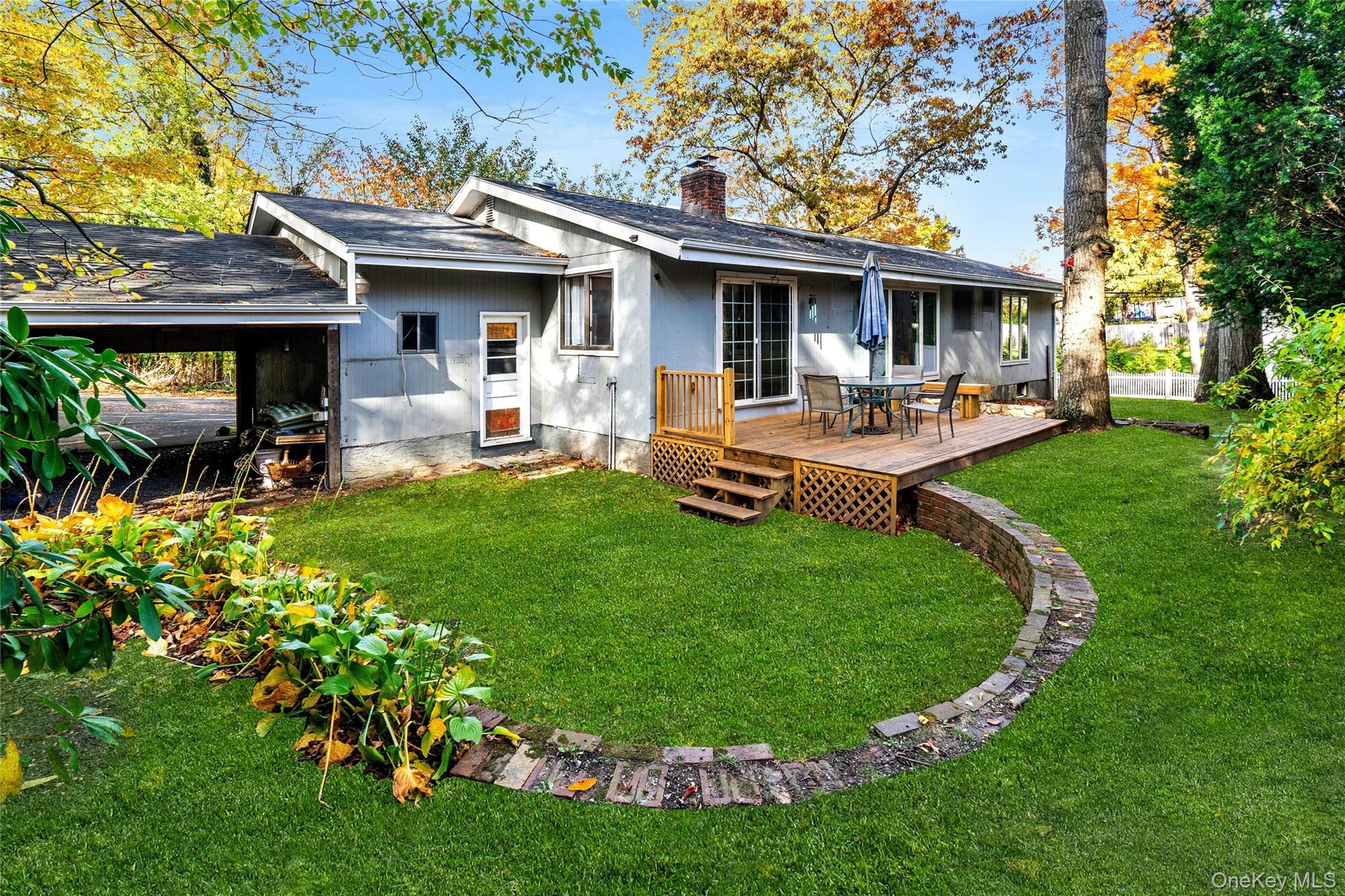 121 Grove Road Kings Park, NY 11754 - Photo 19 of 24 a front view of a house with garden and sitting area