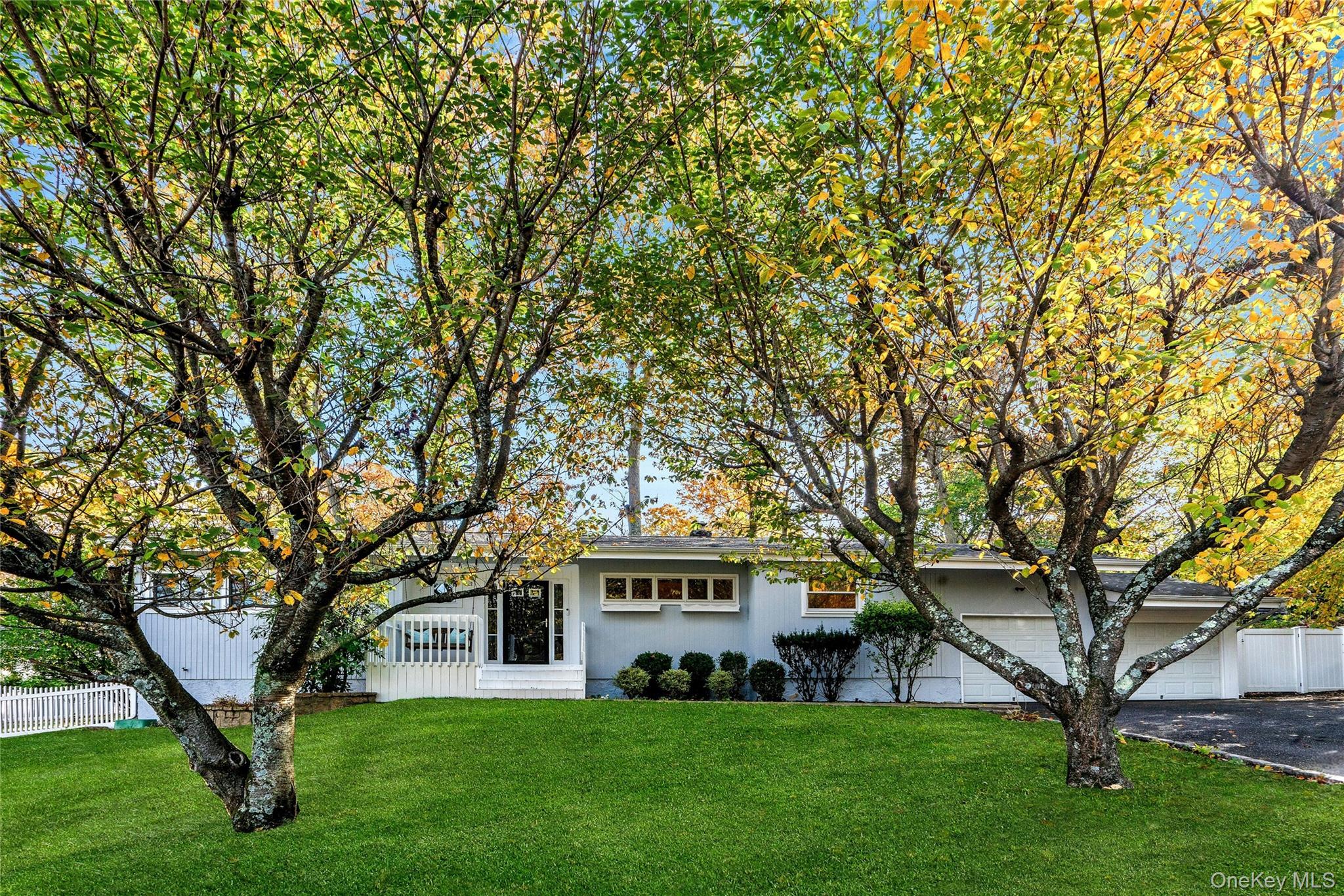 121 Grove Road Kings Park, NY 11754 - Photo 2 of 24 a front view of a house with a garden