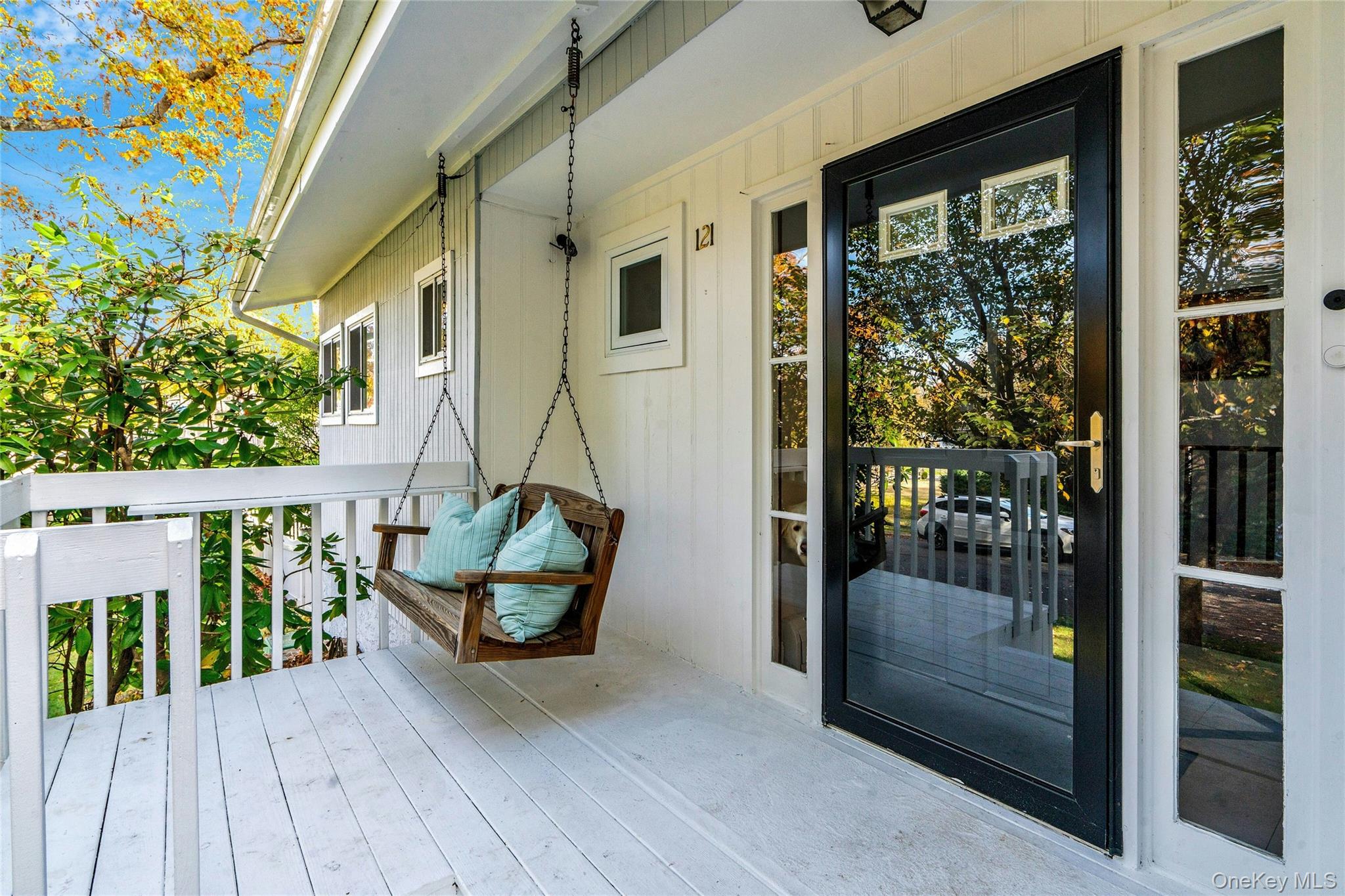 121 Grove Road Kings Park, NY 11754 - Photo 3 of 24 a balcony with furniture and a potted plant