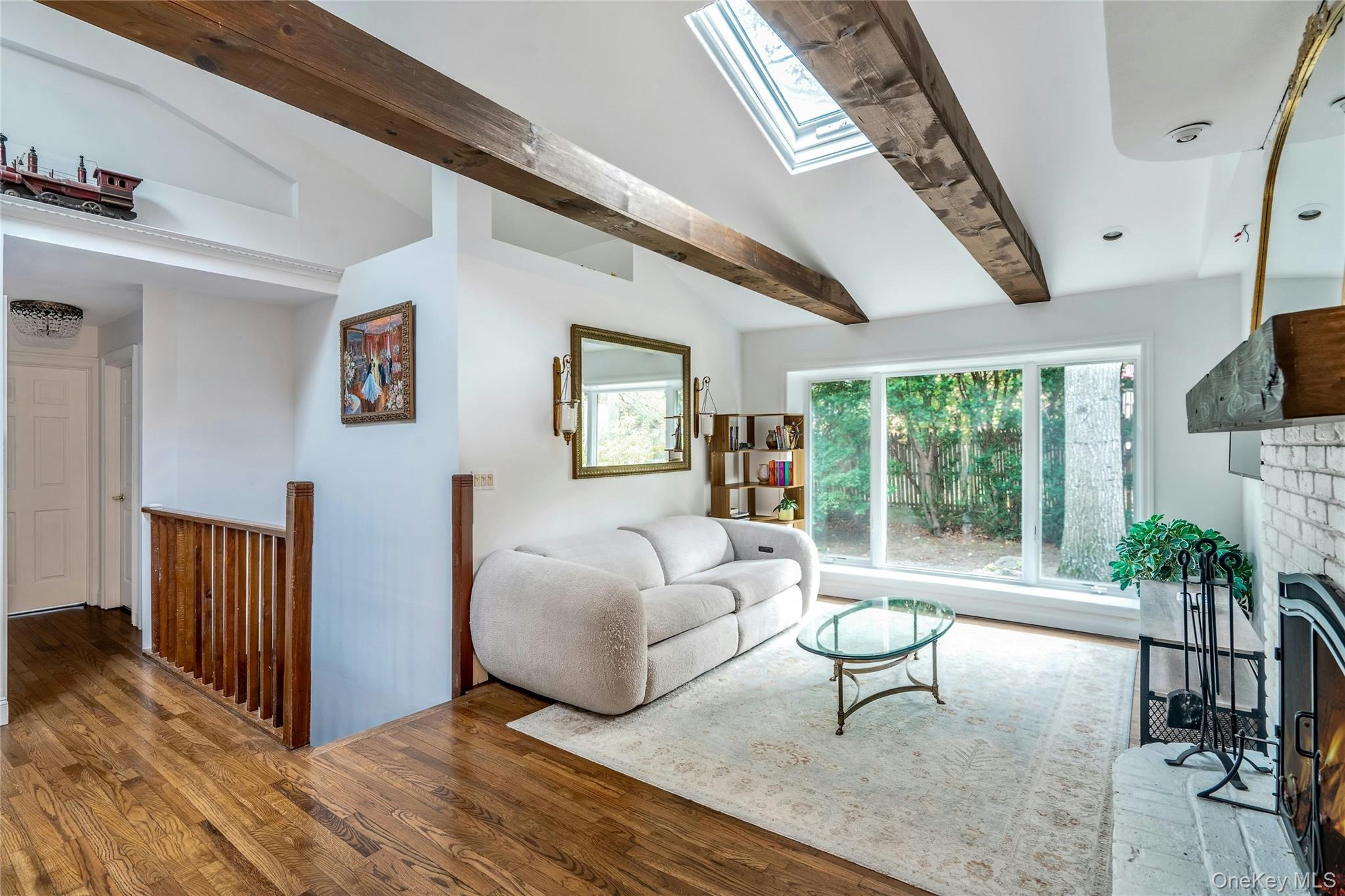 121 Grove Road Kings Park, NY 11754 - Photo 6 of 24 a living room with furniture a window and a flat screen tv
