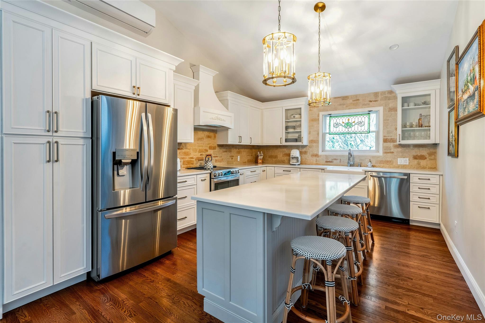 121 Grove Road Kings Park, NY 11754 - Photo 7 of 24 a kitchen with stainless steel appliances a refrigerator a stove a sink a dining table and chairs
