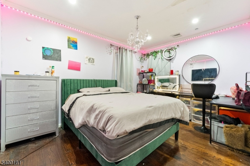 263 Stiles Street Elizabeth, NJ 07208 - Photo 16 of 30 a bed room with a bed and a fish tank