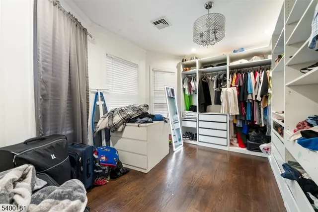 a living room with lots of furniture and gym equipment