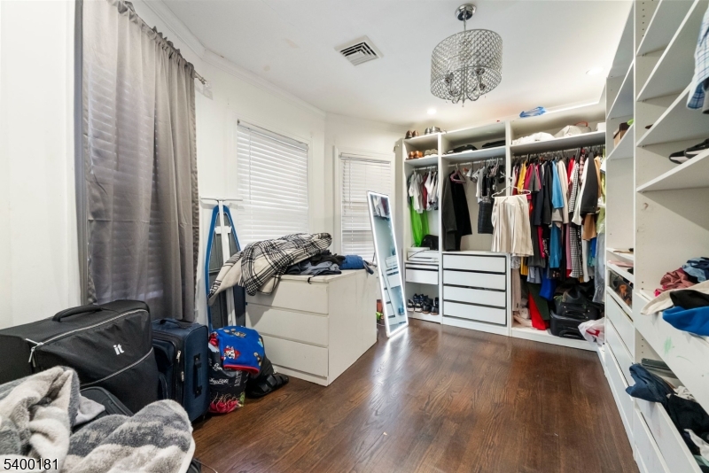 263 Stiles Street Elizabeth, NJ 07208 - Photo 20 of 30 a living room with lots of furniture and gym equipment