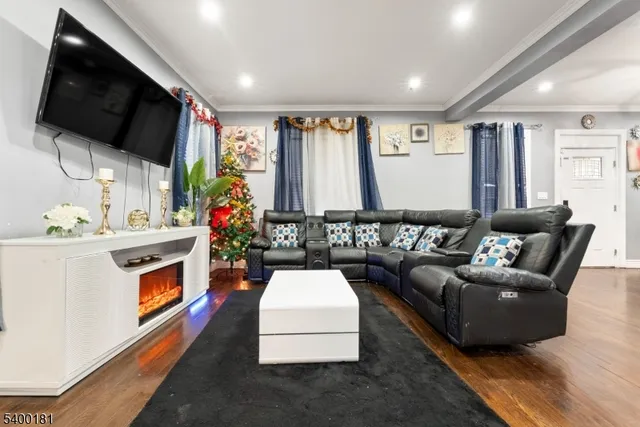 a living room with furniture fireplace and flat screen tv