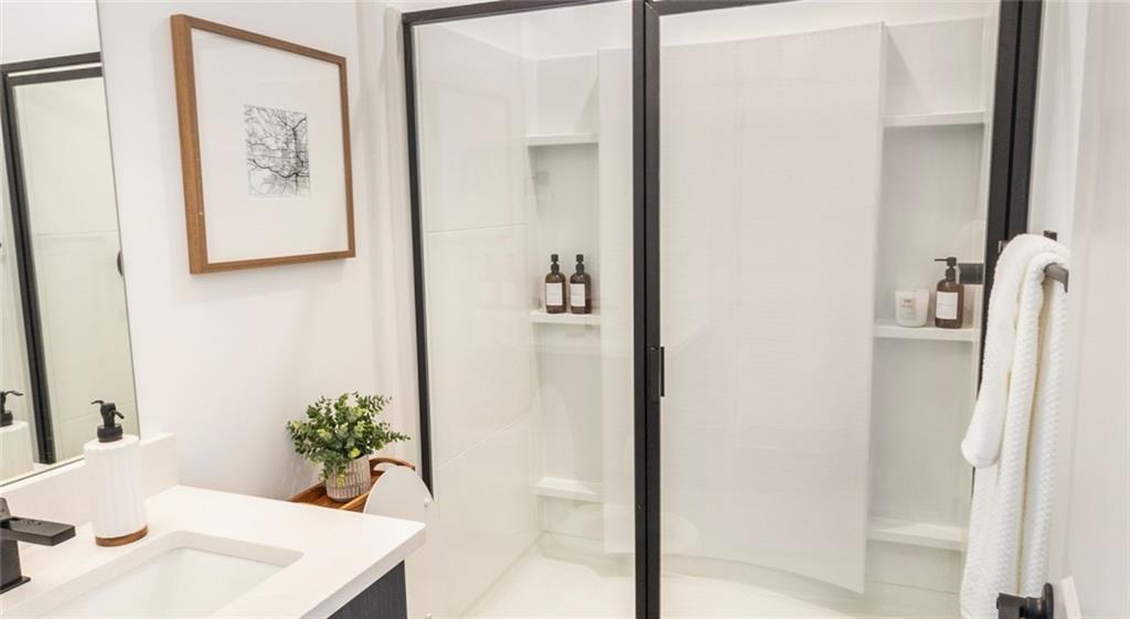 277 Clifton Street Southeast, Unit A1 Atlanta, GA 30317 - Photo 11 of 30 a view of a hallway with furniture and wooden floor