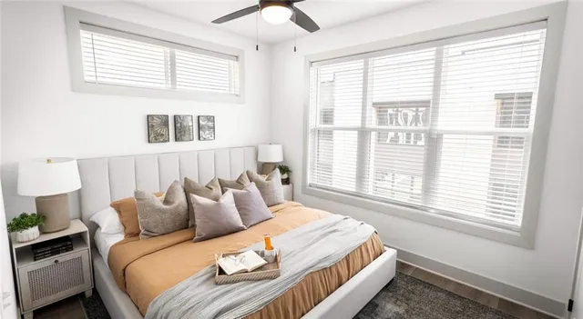 a bedroom with a bed and a window