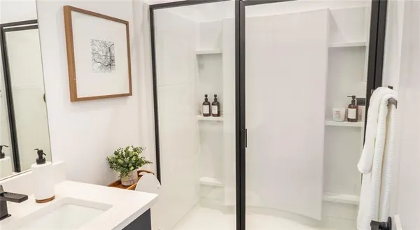 a room that has a bed and a mirror in it