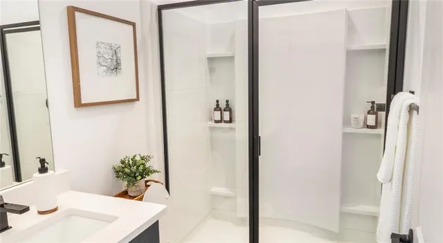 a room that has a bed and a mirror in it