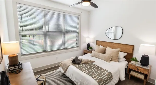 a bedroom with a bed and a window