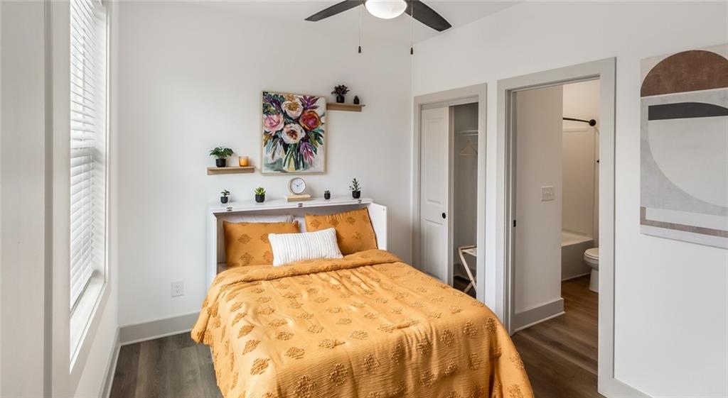 277 Clifton Street Southeast, Unit A1 Atlanta, GA 30317 - Photo 27 of 30 a bedroom with a bed and a chandelier