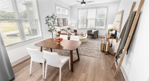 a view of a dining room with furniture and a window