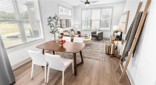 a view of a dining room with furniture and a window