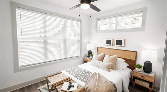 a bedroom with a window and a bed