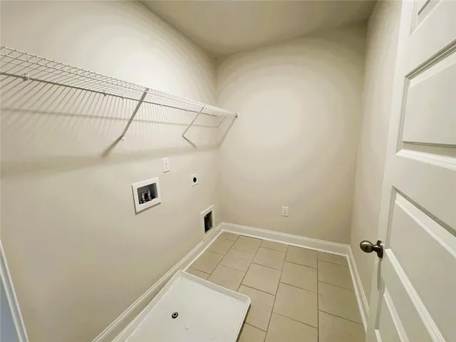 a view of a room with white walls