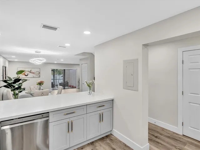 a view of a dining room with furniture and wooden floor