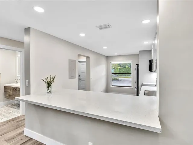 a bathroom with a sink a mirror and shower