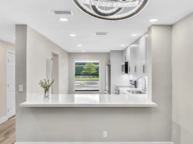 a view of a balcony with furniture