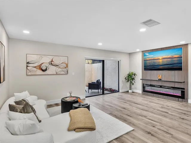 a bathroom with a sink toilet a mirror and shower
