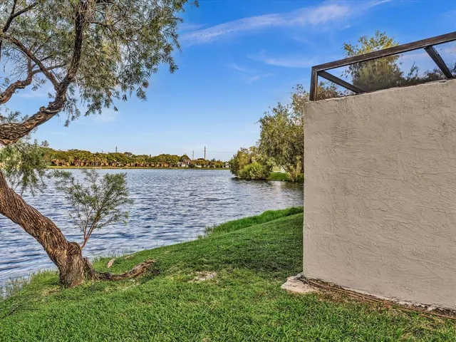 an aerial view of a house with a lake view