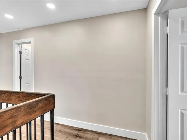 an aerial view of residential building and lake