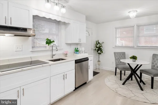 a kitchen with cabinets and window