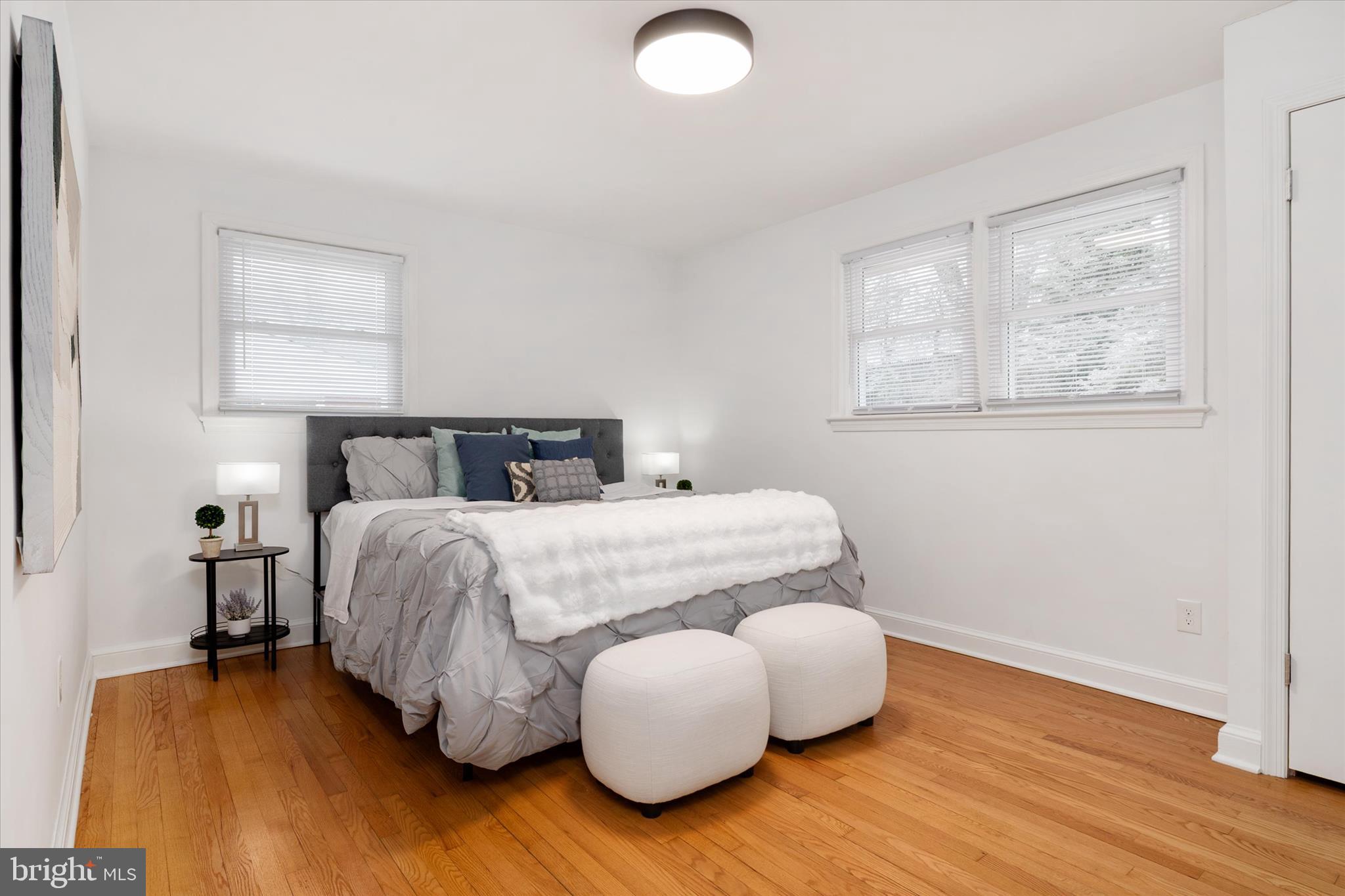 11006 Childs Street Silver Spring, MD 20901 - Photo 15 of 42 a bedroom with a bed and wooden floor