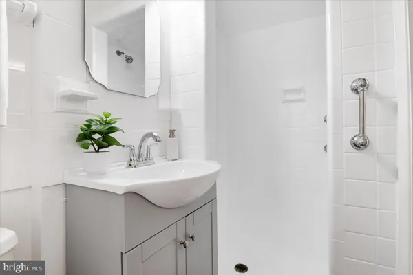 a bathroom with a sink and mirror