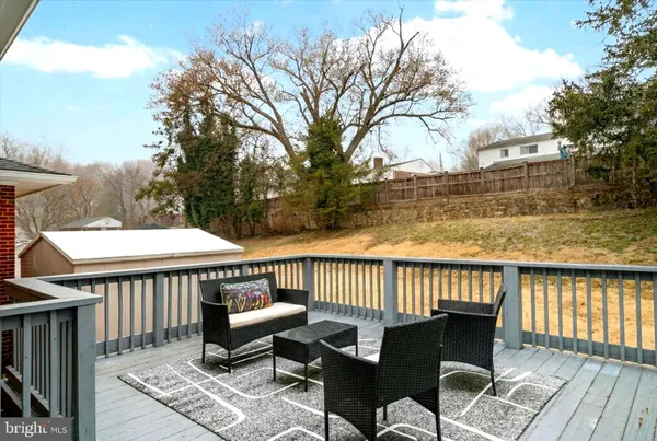 a view of a patio with iron fence