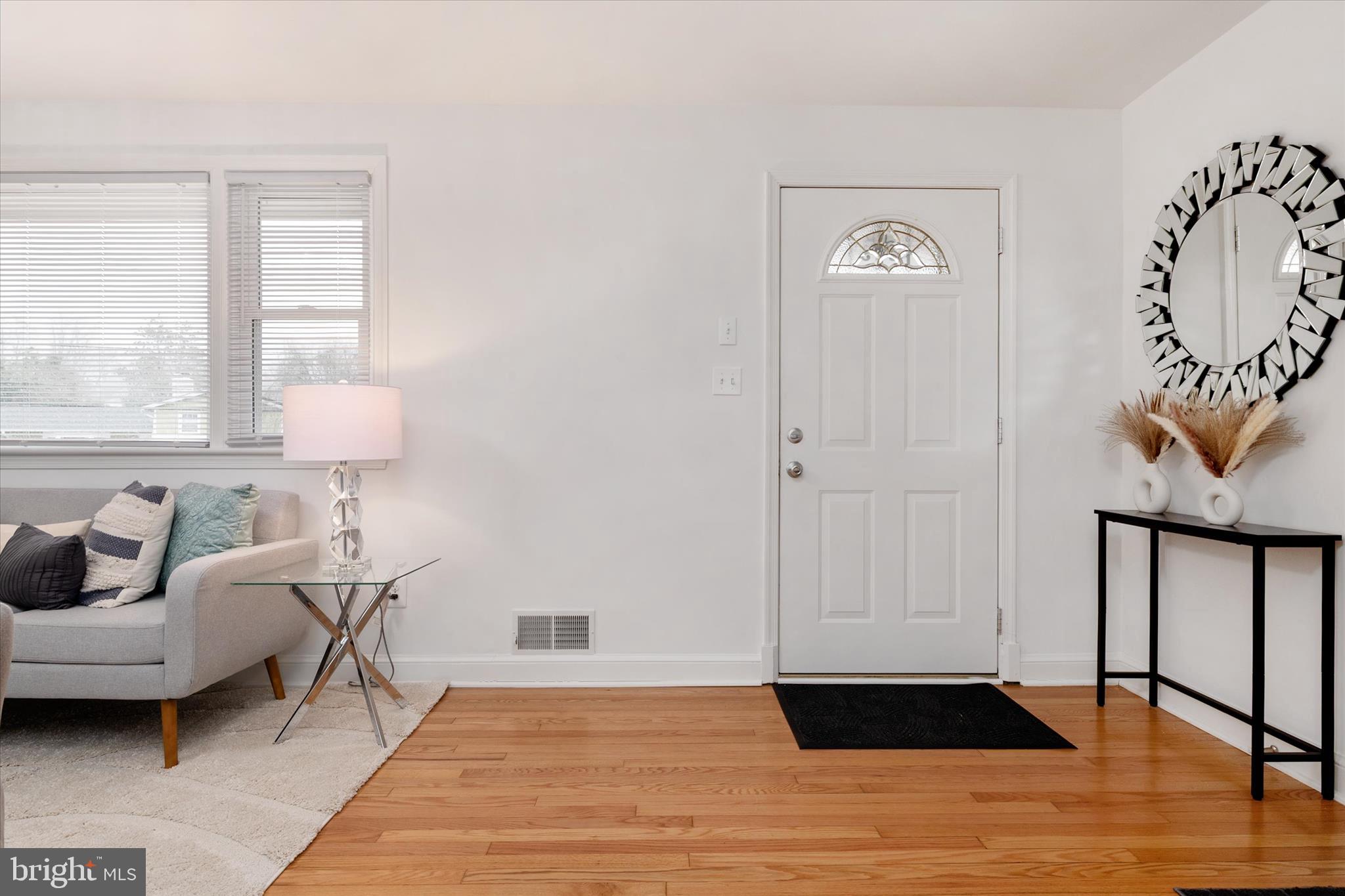 11006 Childs Street Silver Spring, MD 20901 - Photo 4 of 42 a living room with furniture and a window