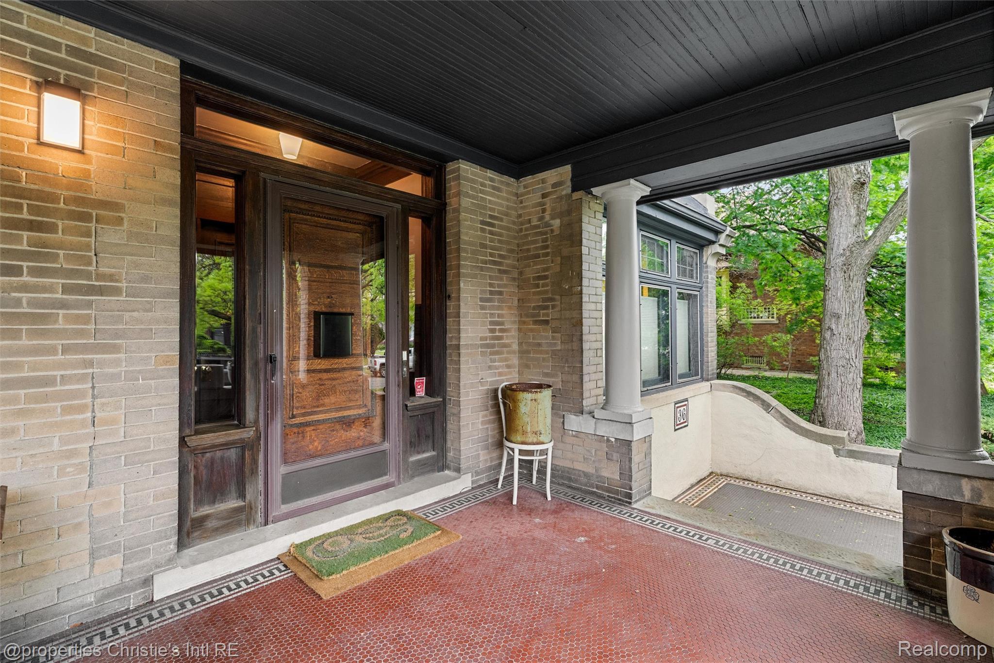 36 Longfellow Street Detroit, MI 48202 - Photo 5 of 81 Doorway to property featuring a porch and brick siding