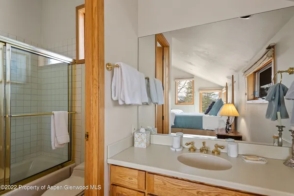 a bathroom with a sink double vanity and shower
