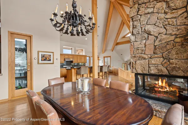a dining room with furniture and wooden floor
