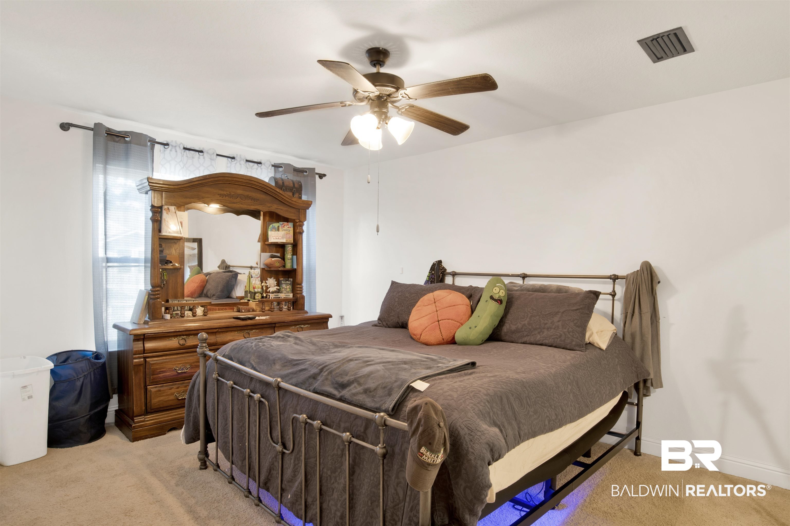 25806 Pollard Road, Unit 80 Daphne, AL 36526 - Photo 10 of 30 Bedroom with light colored carpet and a ceiling fan